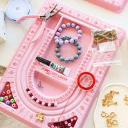 Schmucksets Schmuck gestalten mit Hilfe eines Perlen-Fädelbretts
